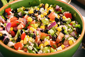 A bowl of farmers market salsa with tomatoes, black beans, and corn