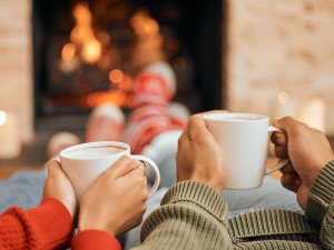 Two people enjoying hot drinks