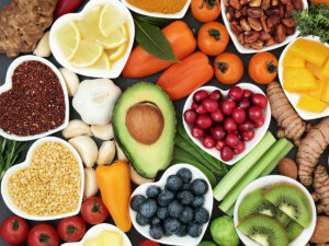A variety of fiber rich foods, including berries, grains, and other fruits and vegetables