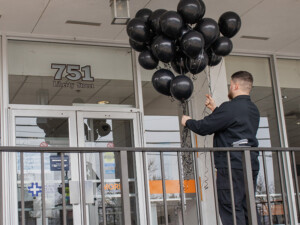 Placing black balloons outside of our Liberty Street Hospital entrance.