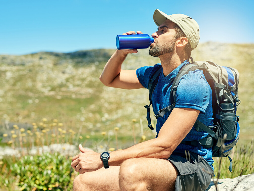Hiker drinking from bottle