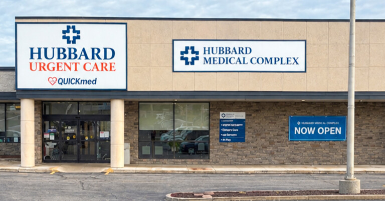 Signs on the exterior of Hubbard Medical Complex, one of which shows Hubbard Urgent Care