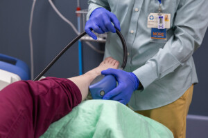 Dr. Anthony Colantonio demonstrates PiezoWave therapy to treat ankle joint pain.